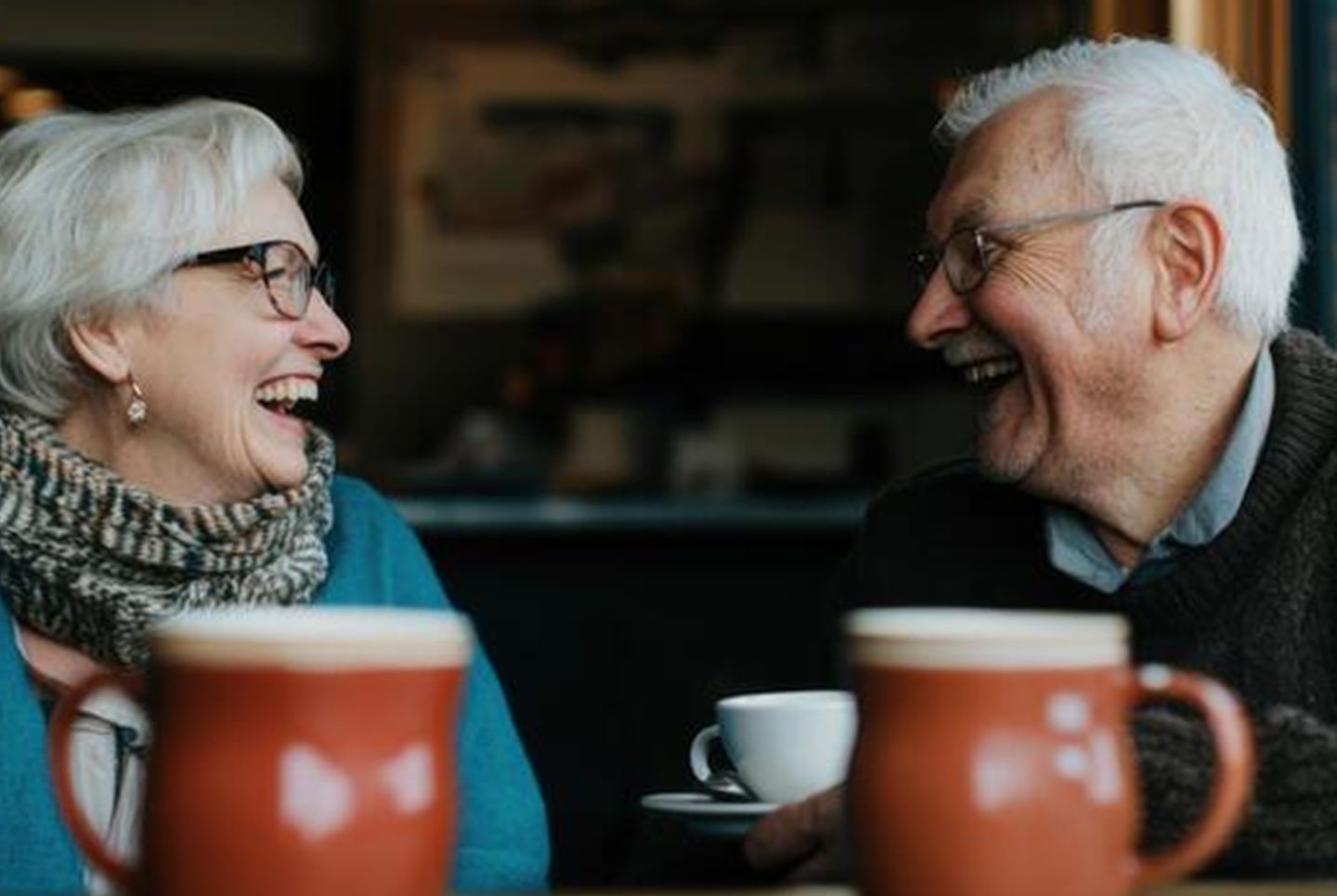 Elderly couple drinking coffee