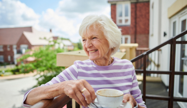 Woman sitting on balcony