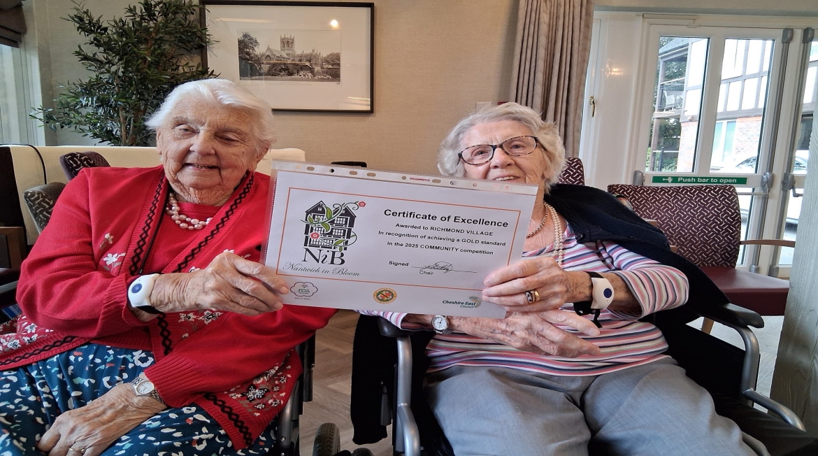 Nantwich Recognised For Beautiful Gardens Two ladies holding a certificate