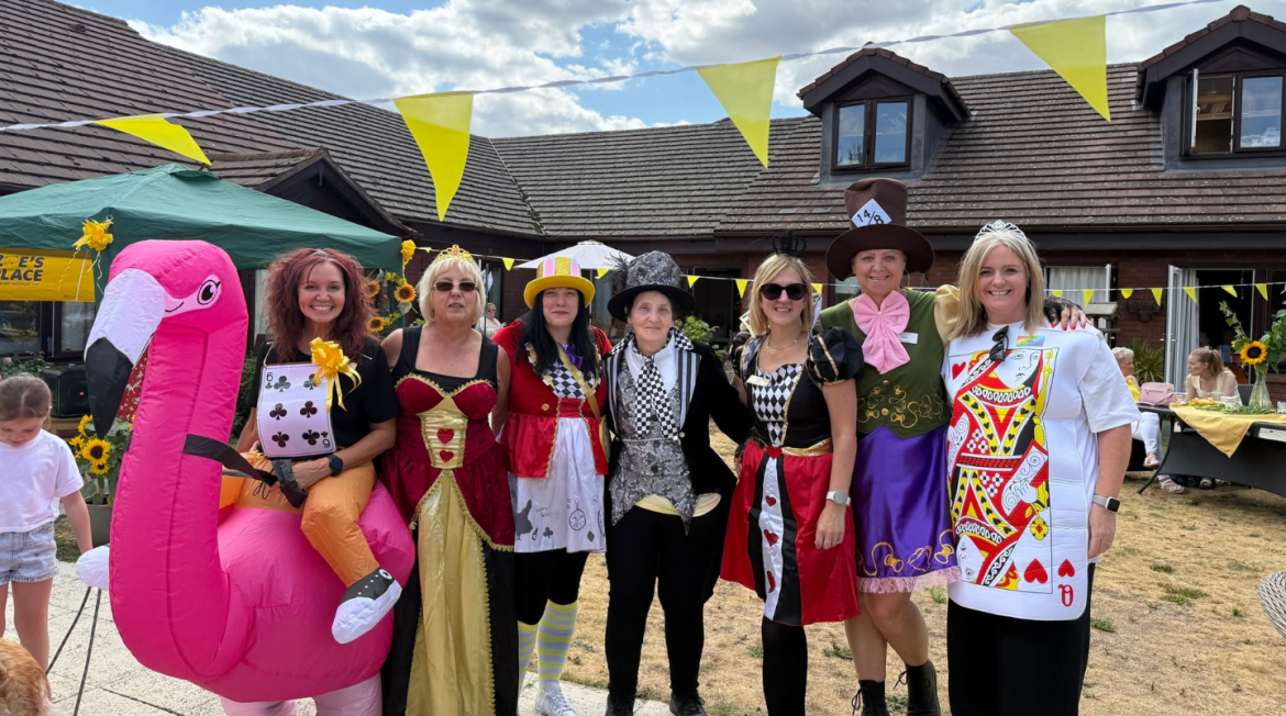 People dressed up smiling at camera