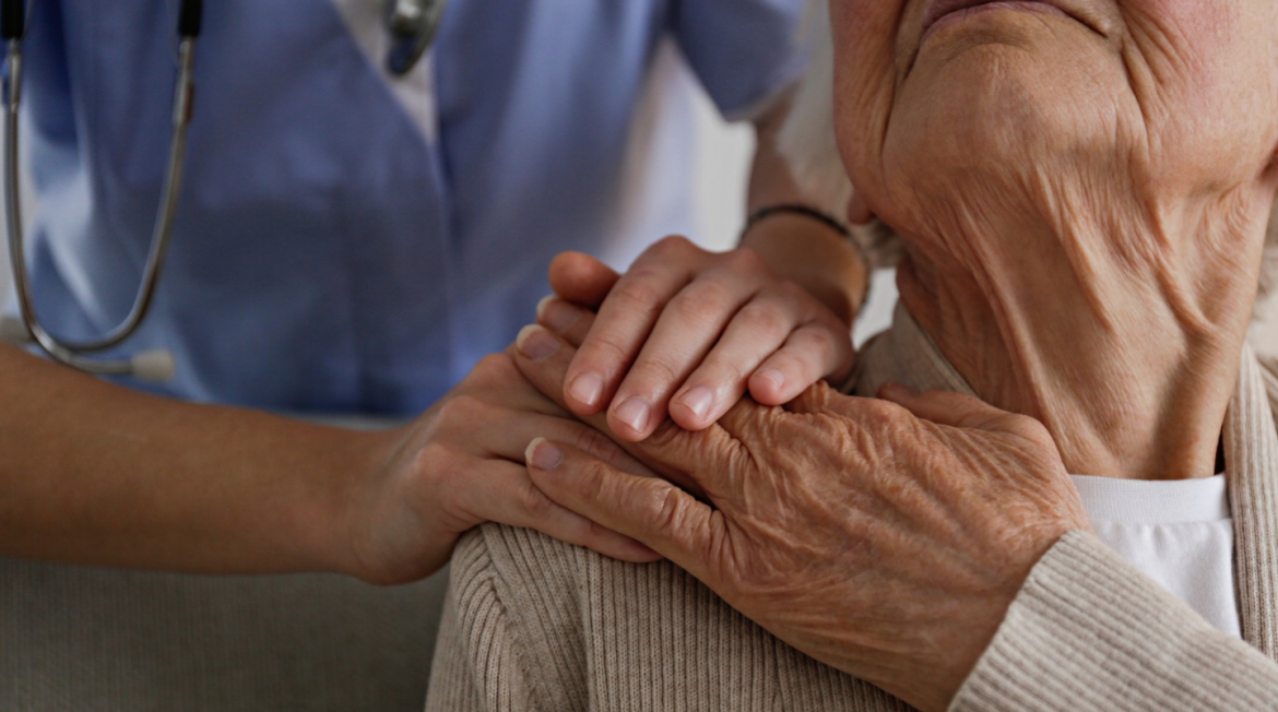 Two people holding hands