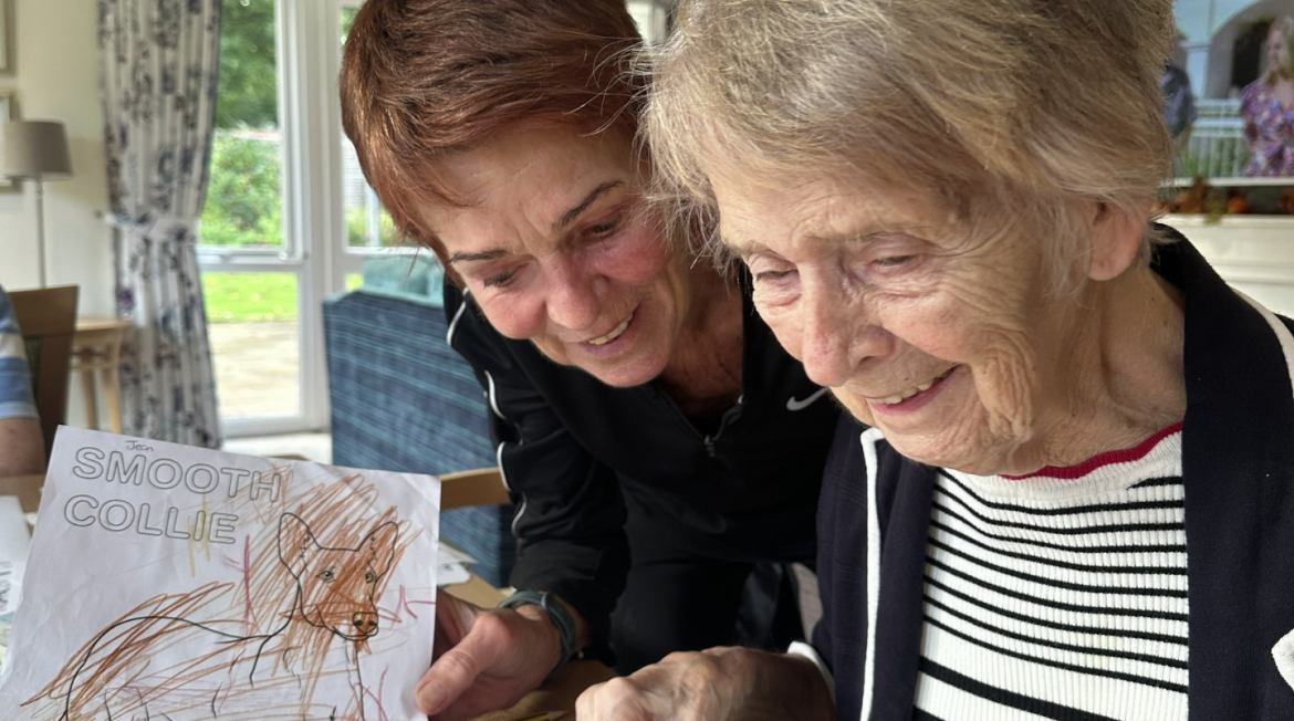 Two people reading a letter