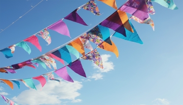 Bunting in front of a blue sky