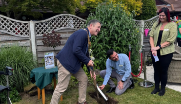 Three people digging