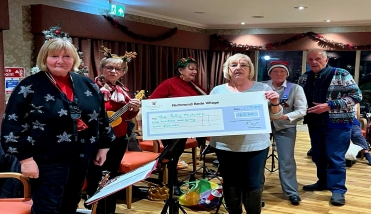 People holding a large cheque